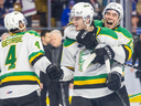 William Nicholl leaps onto the back of Sam Dickinson as the London Knights celebrate their OHL playoff series-clinching victory over the Kitchener Rangers at the Auditorium in Kitchener on Thursday April 18, 2024. The Knight won the game 4-3 and the series 4-0. (Derek Ruttan/The London Free Press)