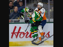 Landon Sim of the London Knights and Tristan Bertucci of the Flint Firebirds collide during Game 2 of their Ontario Hockey League playoff series at Budweiser Gardens in London on March 31, 2024. Mike Hensen/The London Free Press