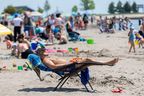 Bob Vigars is the most relaxed person on Port Stanley Beach on Monday, May 20, 2024.