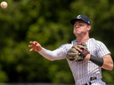 London Majors second baseman Tyler Mosher charges in for a ground ball out and fires it during their Intercounty Baseball League game against the Hamilton Cardinals at Labatt Park in London on May 26, 2024. Mike Hensen/The London Free Press