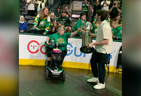 London Knights player Landon Sim gives fan Louise Letniowski an up-close look at the OHL championship trophy at Budweiser Gardens Saturday. (Jane Sims/The London Free Press)