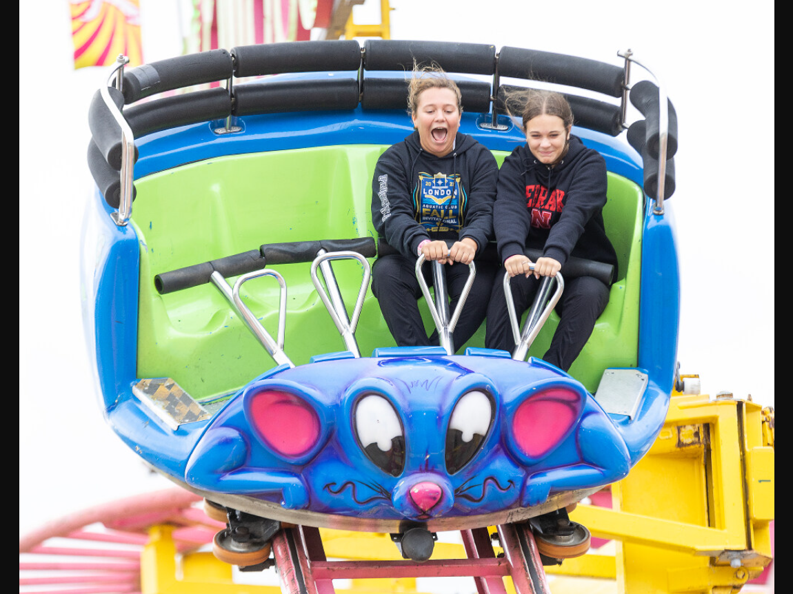 Sisters Emily (left) and Allie Regan-Swift ride the Crazy Mouse at the Western Fair in London on Friday September 6, 2024. Derek Ruttan/The London Free Press
