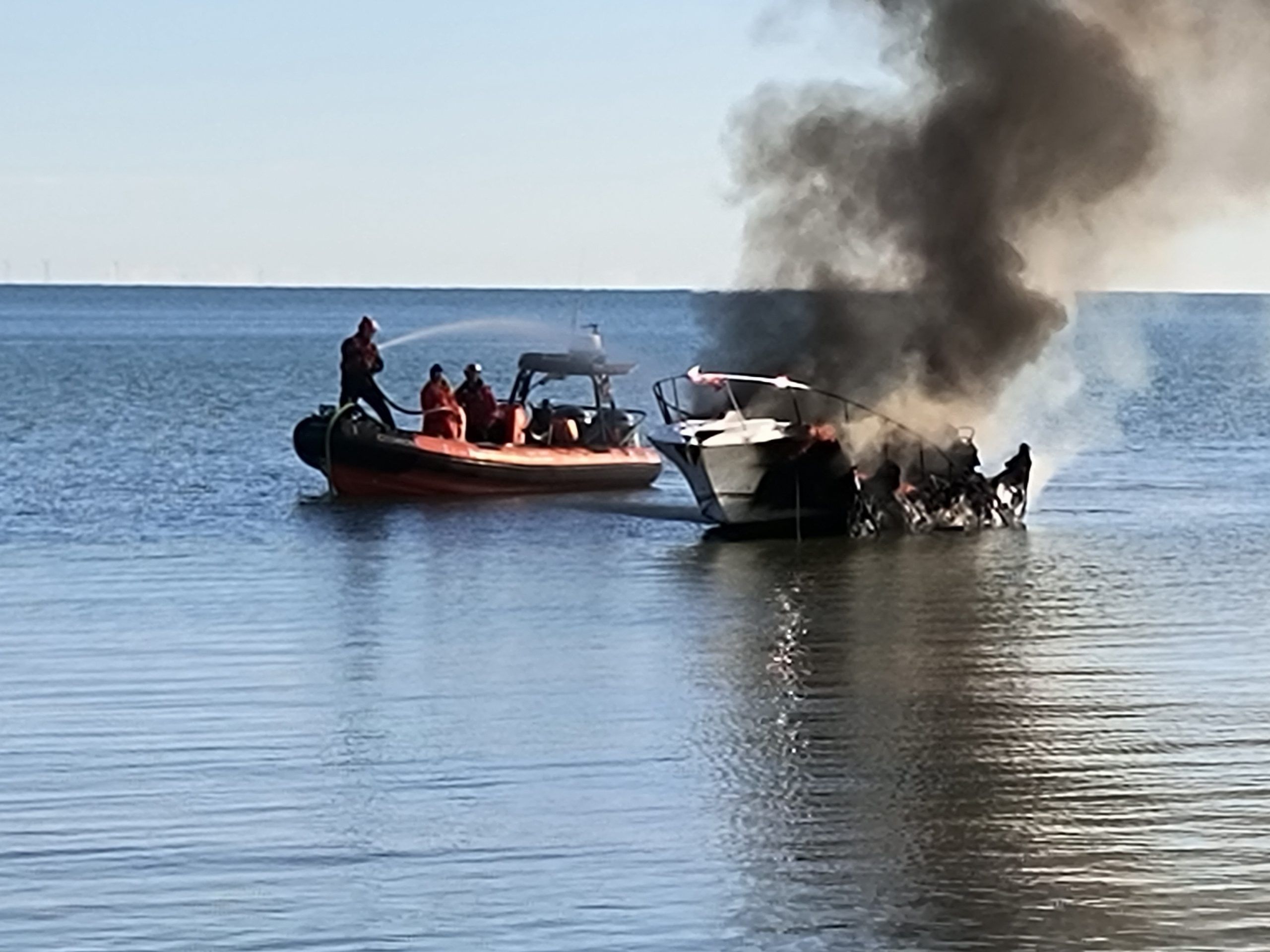 Boat owner's fast action, chilly swim protects other vessels from fire