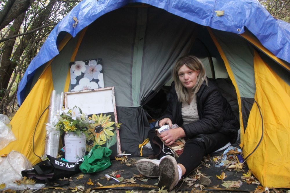 Tanya Burke, 44, is shown inside the tent where she lived before she moved into an apartment over the weekend, ending her long stretch of homelessness. (Beatriz Baleeiro/The London Free Press)