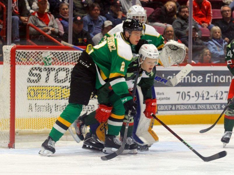 Soo Greyhounds forward Owen Allard and London Knights defender Henry Brzustewicz battle for space in front of Knights goalie Austin Elliott during first period OHL action at the GFL Memorial Gardens in Sault Ste. Marie on Wednesday Nov 6, 2024. (Gordon Anderson/ Postmedia)