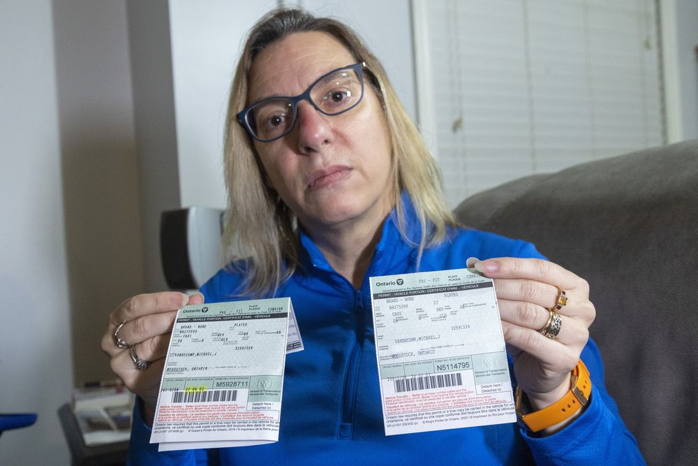 Jackie Leroux-Vandecamp shows two different ownerships, their original which is signed, and then a later version sent out saying the original ownership was mistakingly transferred to a car dealership in Watford. Photograph taken on Wednesday November 20, 2024. (Mike Hensen/The London Free Press)