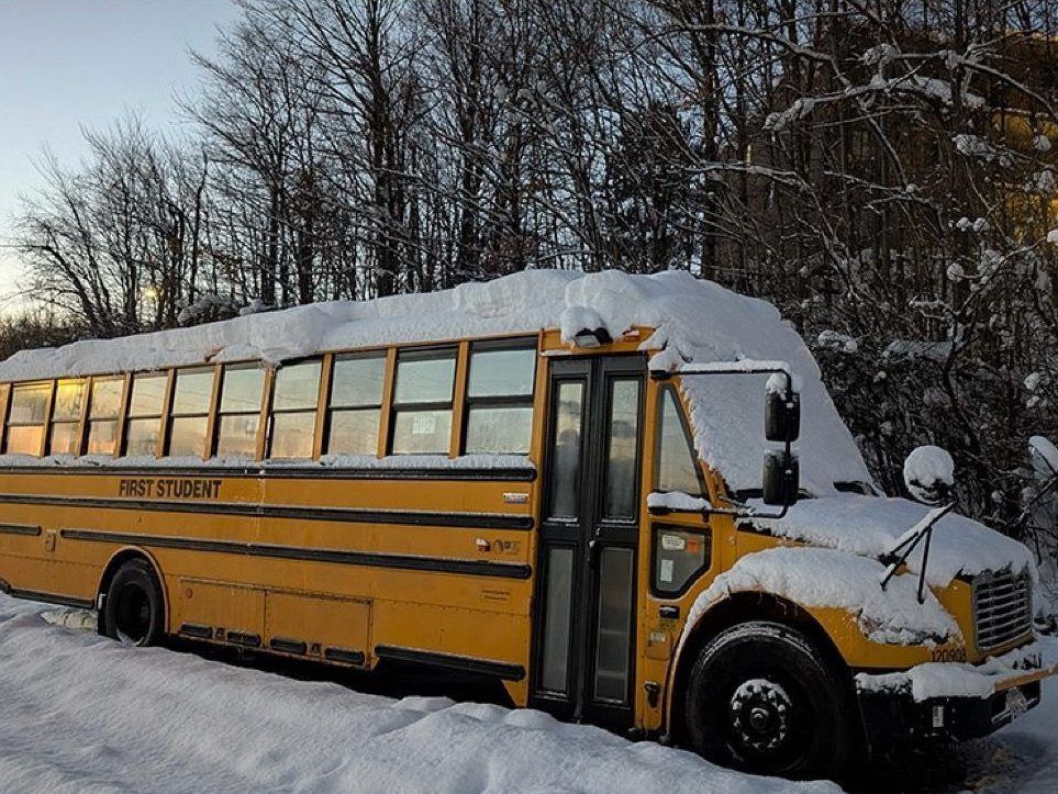 A snow-covered school bus looks like it won't be going anywhere. (Postmedia News)
