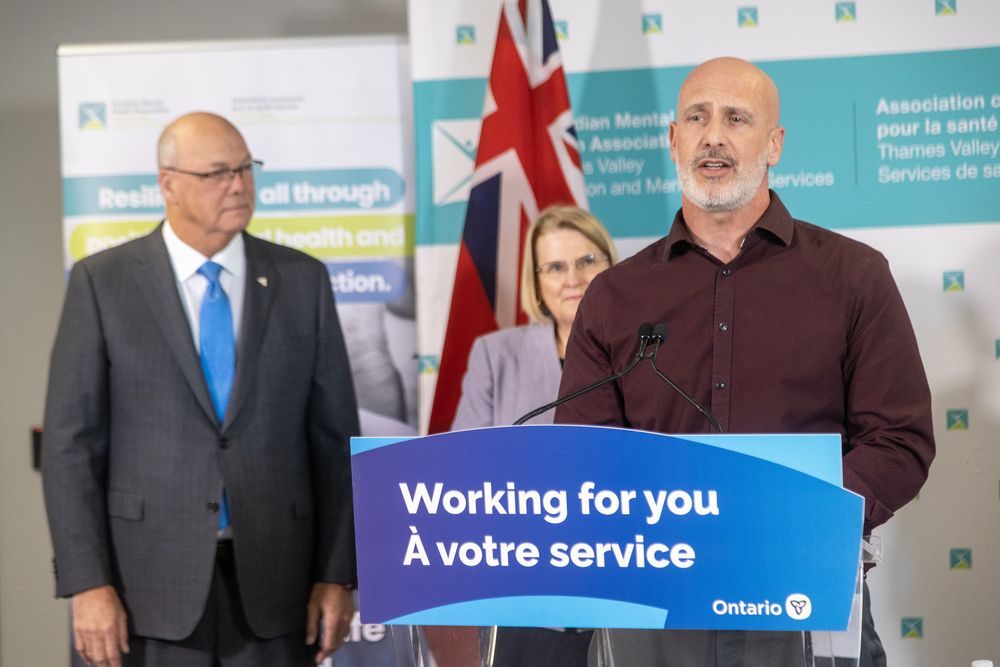 With Elgin-Middlesex-London MPP Rob Flack and deputy premier and Minister of Health Sylvia Jones at his side, Dean Astolfi, vice-president of supportive housing at CMHA Thames Valley Addiction and Mental Health Services, speaks about a new homeless hub for London at a news conference at the agency’s London office on Monday, Jan. 27, 2025. (Derek Ruttan/The London Free Press)