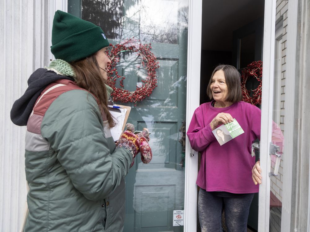 Green Party candidate Carol Dyck speaks with Wendy Reid while canvassing the London North Centre riding in London on Monday, Feb. 10, 2025. (Derek Ruttan/The London Free Press)