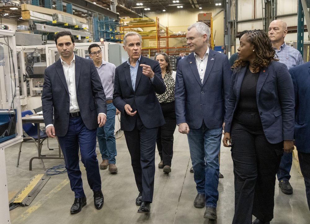 Prime Minister Mark Carney tours the Armo Tool and Abuma Manufacturing plant with company president and CEO Ben Whitney in London, Ont., on Wednesday, March 26, 2025. Carney is accompanied by candidates Peter Fragiskatos and Arielle Kayabaga. (Derek Ruttan/The London Free Press)