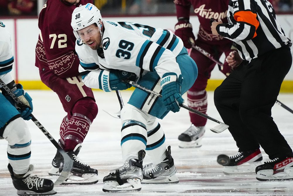 San Jose Sharks centre Logan Couture wins a faceoff against the Arizona Coyotes during their NHL game on April 1, 2023, in Tempe, Ariz. (AP Photo/Ross D. Franklin)