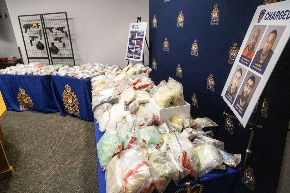 Guns, cash and drugs discovered during the London Police Service’s largest ever seizure of fentanyl in London, Ontario on Wednesday May 28, 2025. (Derek Ruttan/The London Free Press)