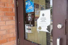 broken window mars the door of Fresh and Fast Food Mart