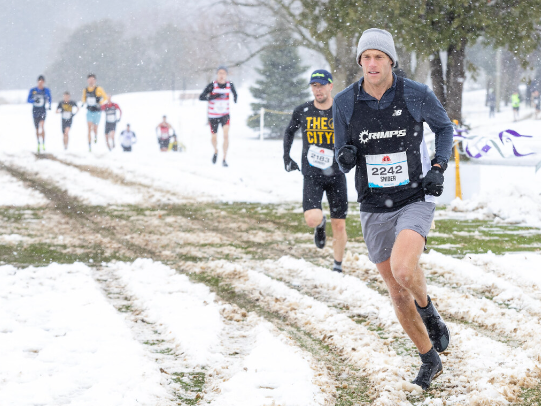 Hundreds of runners faced down Sunday's snow and frigid temperatures to compete in the Canadian Cross Country championships at Fanshawe Golf Course in London.