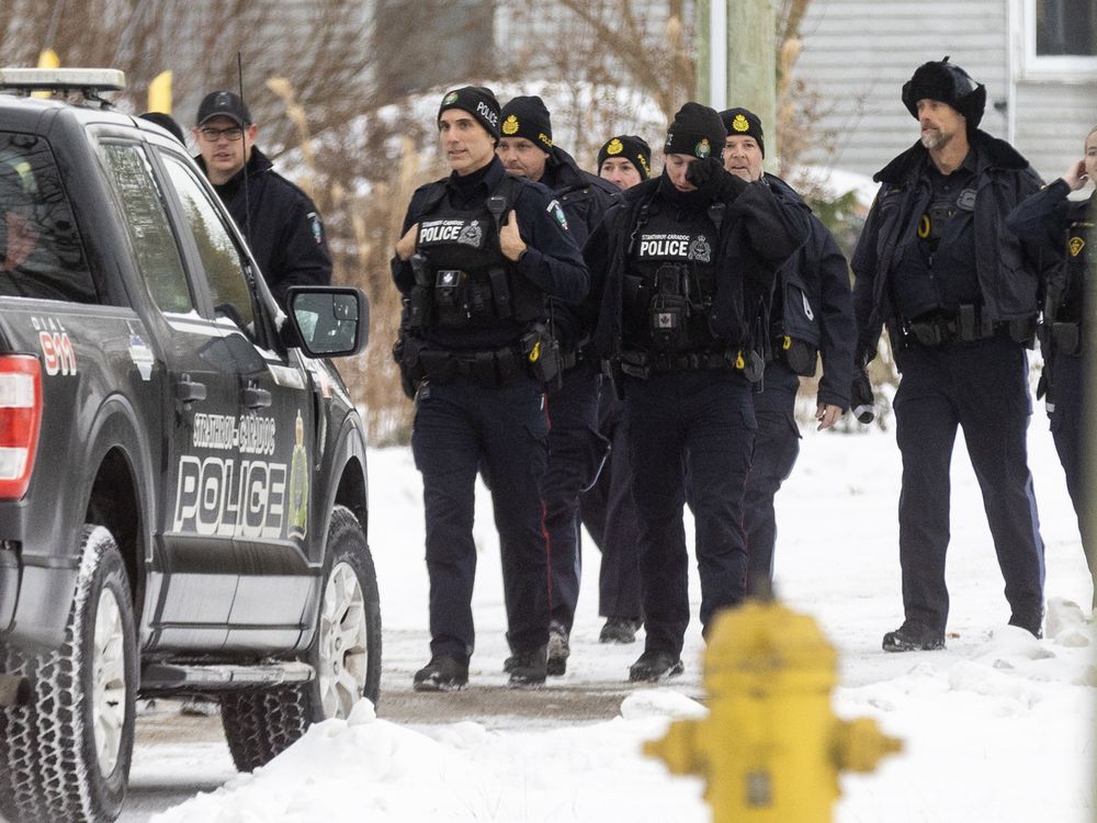  Officers with the Strathroy-Caradoc police and the Ontario Provincial Police responded to an incident at a home on Scott Street in Strathroy on Tuesday December 9, 2025. (Derek Ruttan/The London Free Press)