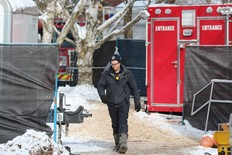 A member of the London Fire Department leaves 212 Chesham Place