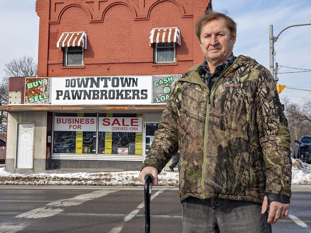 Kevin Elliott stands in front of his Downtown Pawnbrokers store in Brantford, Ontario on Thursday January 7, 2026. He was shot seven times and beaten by a group of armed robbers in 2025.