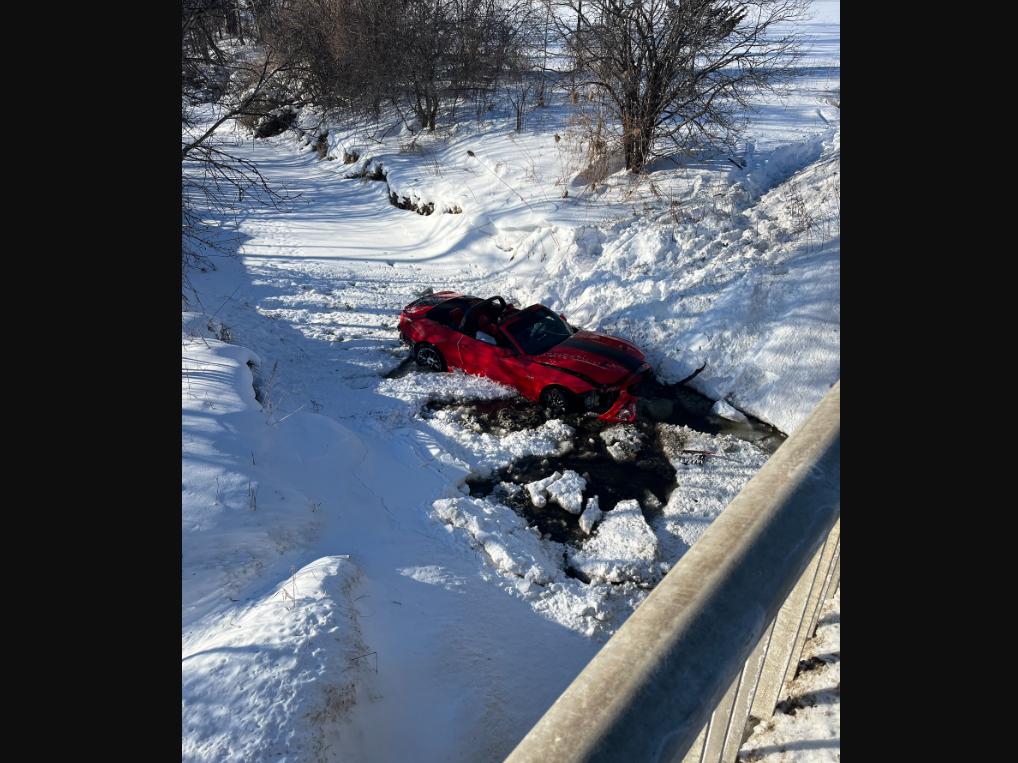 Firefighters rescued a man whose convertible – a key detail that aided in getting him to safety – crashed off a bridge into a south London creek on Sunday afternoon.