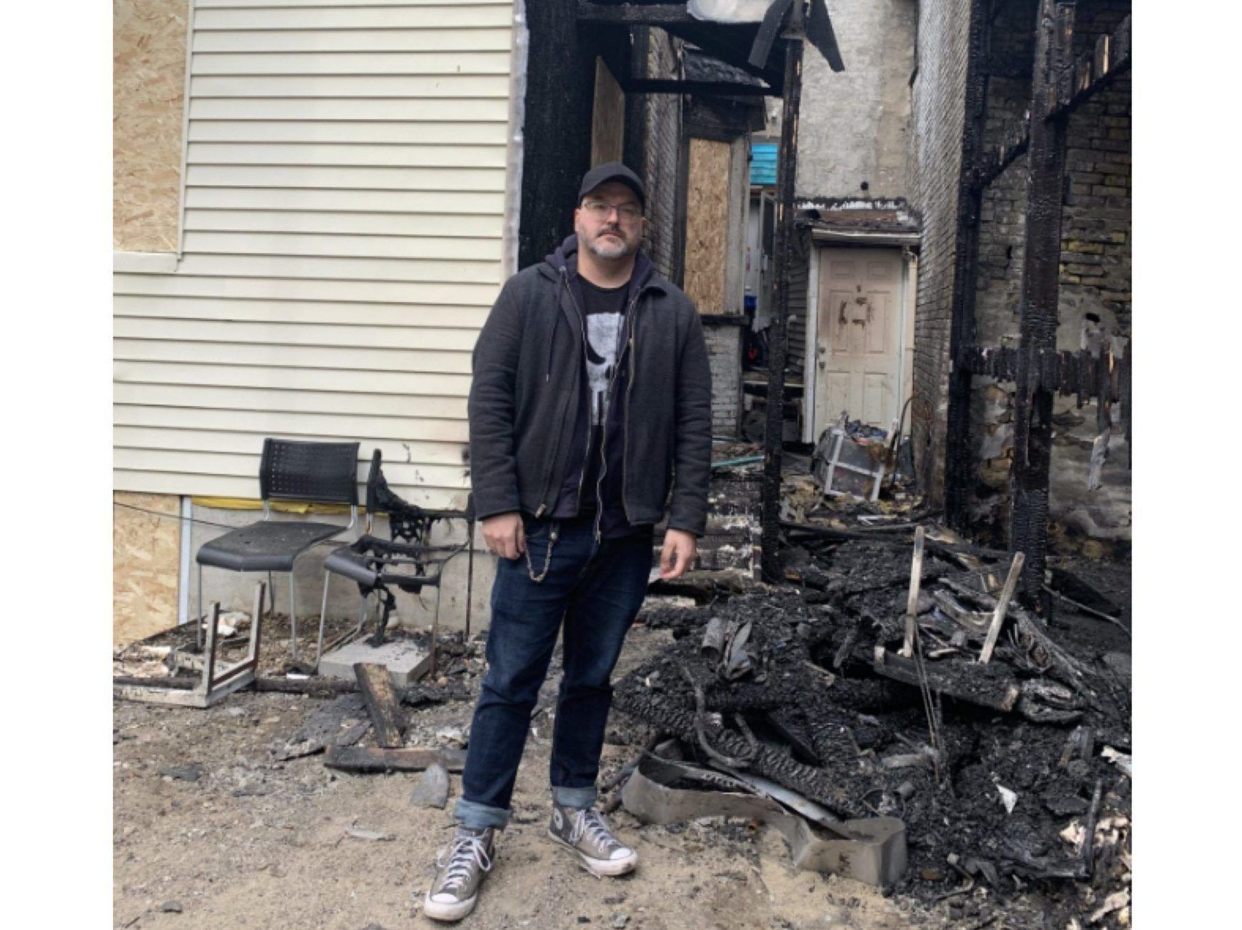 Artist sifts through ashes after fire guts home, destroys 15-year project