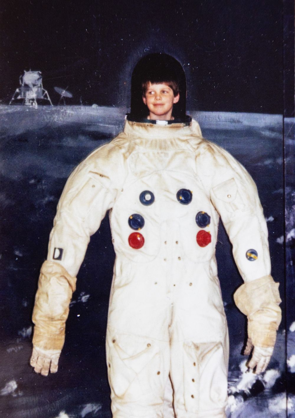  Jeremy Hansen poses inside an old Apollo spacesuit in a museum in Florida at the age of six. Photograph handout by Gary and Nancy Hansen.