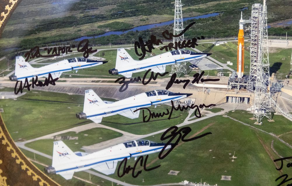  A signed photograph of the four Artemis II astronauts in T-38s flying over the launch pad of Artemis I in Florida. Jeremy Hansen is third from the top. Photograph handout by Gary and Nancy Hansen.