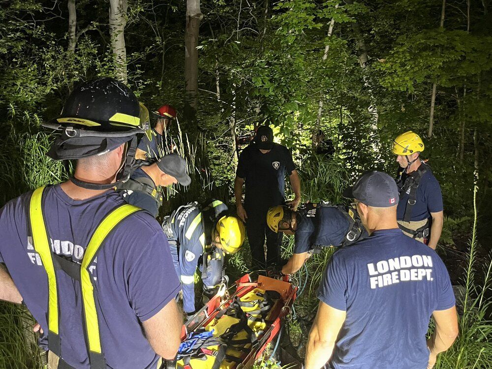 Emergency services were called to remove two people from a ravine