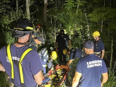 Emergency services were called to remove two people from a ravine