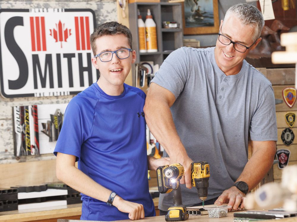 The father-son project has sold hundreds of handcrafted flags to help build a special fund for long-term support.