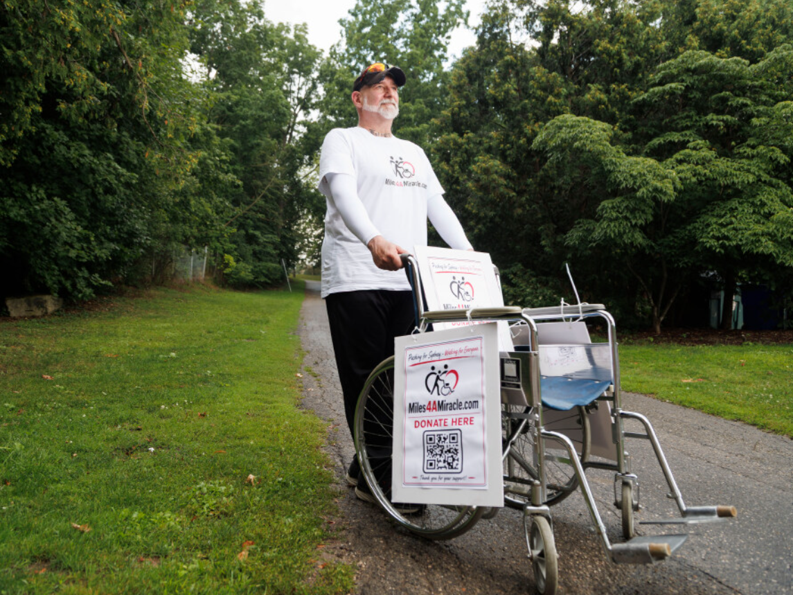 London dad pushing daughter's wheelchair 200 km in fight for $493K surgery