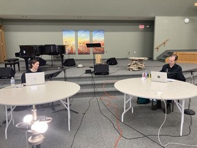 Caitlin Vancoughnett (left) and Tim Bratton (right) work on their recorded reading of Andrew Kooman's new play Delft Blue, which will be presented by Saskatoon's Burnt Thicket Theatre online from Nov. 11 to 30.