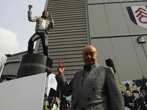 LONDON, ENGLAND - APRIL 03:  Fulham chairman Mohamed Al Fayed unveils a statue in tribute to Michael Jackson prior to the Barclays Premier League match between Fulham and Blackpool at Craven Cottage on April 3, 2011 in London, England.  (Photo by Ian Walton/Getty Images)