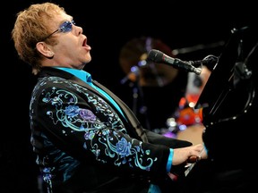 Singer/songwriter Elton John performs onstage at The Citizens Business Bank Arena on Nov. 5, 2010 in Ontario, California. Photo by Kevin Winter/Getty Images