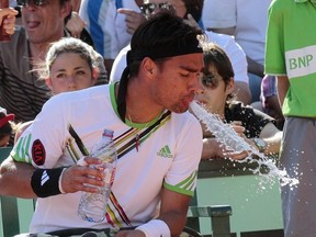 Italia's Fabio Fognini spits during his Men's second round match in the French Open tennis championship at the Roland Garros stadium, on May 25, 2011, in Paris.     AFP PHOTO / JACQUES DEMARTHON (Photo credit should read JACQUES DEMARTHON/AFP/Getty Images)