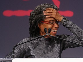 Dionne Brand reacts to being named winner of the 2011 Griffin Poetry Prize for Ossuaries in Toronto' on June 1, 2011. Photo: Peter J. Thompson, National Post