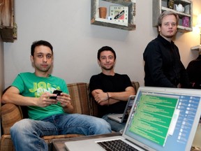 Lenny Rachitsky (center) and Beau Haugh (right), co-founders of Localmind and Nelson Gauthier, mobile developer, are seen in Lili and Oli cafe, in Montreal Monday May 16, 2011. The iPhone app uses location information from Facebook and Foursquare to find out where members are, and allow other members to ask them questions. (Allen McInnis / THE GAZETTE)