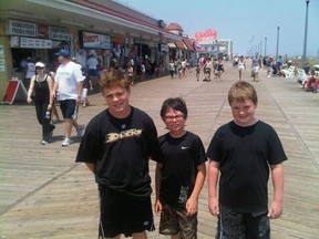 Sam Bird (l), Charlie Bird (r) on the boardwalk at Rehoboth Beach with their new English friend, Raymond, who thinks he's from Cambridge but isn't sure.