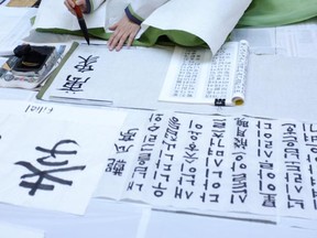 Korean, Japanese and Chinese Calligraphy workshop, presented by CinéAsie, July 30, 2011 at the Fantasia Film Festival in Montreal.  Photo by CinéAsie.