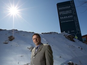 Serge Bizien, sales director for Groupe Cholette, poses in front of a District Griffin sign in this March file photo