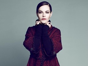 MONTREAL, QUE.: AUGUST 06, 2011 --  Emily Hampshire in Chanel Red tweed three-quarter coat  $7,725. Worn with silk and nylon damask stretch skinny pants, $1,550, black cashmere turtleneck, $2,350. All at Chanel, Holt Renfrew. Triple band in black pavÃ© ring, $235 at Agatha.  - (Photo: Max Abadian For Urban Expressions only)
