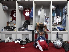 MONTREAL, QUE.: NOVEMBER 13, 2011 -- Montreal Alouettes Brandon Whittaker hangs his head in the team's locker room following their loss to the Hamilton Tiger Cats in the Canadian Football League East Semi-Final game at the Olympic Stadium in Montreal Sunday November 13, 2011.      (John Mahoney/THE GAZETTE)