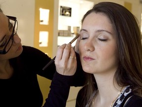 MONTREAL, QUE: APRIL 12, 2011-- Makeup artist Marie-Dominique Lapointe (L) applies makeup on model Carlotte Rossi at Institut Guerlain on     Tuesday April 12, 2011. (Pierre Obendrauf / THE GAZETTE)