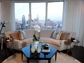 MONTREAL, QUE.: March 23, 2011--views, views, views: the view from the living room of Reesa Huberman and Joel Rosen's downtown penthouse apartment overlooking Montreal. The sofa is a Barbara Barry design; the end tables and coffee table are by Montreal interior designer Scott Yetman. Orchid from Westmount Florist.  (Bryanna Bradley / THE GAZETTE)