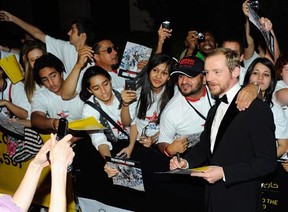 Actor Simon Pegg signs autographs at the Mission: Impossible - Ghost Protocol premiere, December 7, 2011 in Dubai.  (Andrew H. Walker/Getty Images for DIFF)