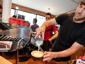 MONTREAL, QUE: THURSDAY JULY 22, 2010. -- - Anthony Benda puts the finishing touches on a cappuccino at Cafe Myriade, 1432 Rue Mackay in Montreal Thursday, July 22, 2010. (Peter McCabe / THE GAZETTE )