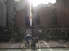 NEW YORK, NY - JANUARY 25:  A man rides his bicycle by an empty lot on January 25, 2012 in New York City.  Homeless activist group Picture the Homeless will release findings from a new study conducted with Hunter College in which a count of vacant buildings and lots in 20 of NYC's 59 community boards was conducted. The findings, which will be released tomorrow in full, found that vacant properties in New York City could house every homeless person and more. The report, "Banking on Vacancy: Homelessness and Real Estate Speculation," is the latest in a six-year campaign to document vacant properties  in New York City. According to Coalition for the Homeless, in New York City 41,200 homeless men, women, and children sleep each night in municipal homeless shelters.  (Photo by Spencer Platt/Getty Images)