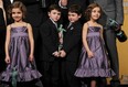 Actors from TV show Boardwalk Empire hold their  award for best ensemble in a drama series in the press room at the 18th Annual Screen Actors Guild Awards at the Shrine Auditorium in Los Angeles, California on January 29, 2012. The twin girls are Lucy and Josie Gallina  and the twin boys are Brady and Connor Noon. The boys seem to have quite a tight grip on the award, don't they? As if they're both thinking, "Let go! It's MINE!"
(FREDERIC J. BROWN/AFP/Getty Images)