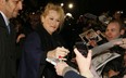 US actress Meryl Streep signs autographs for fans on the blue carpet as she arrives to attend the European premiere of the film The Iron Lady at BFI Southbank in London on January 4, 2012.  (JUSTIN TALLIS/AFP/Getty Images)