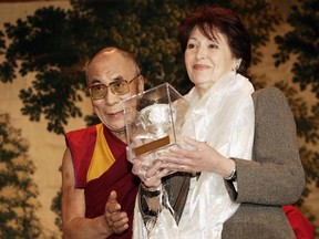 Tibetan spirtual leader Dalai Lama gives the Light of Truth award to Fanny Rodwell on June 1, 2006 in Brussels, Belgium. Desmond Tutu and Fanny Rodwell, founder and President of the Herge Foundation received the Light of Truth Awards,  the most important Tibetan award in the world, honouring individuals and organizations who made a contribution to the concept of Tibet. (Mark Renders/Getty Images)