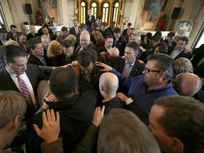 MCKINNEY, TX - FEBRUARY 08:  Supporters pray over Republican presidential candidate, former U.S. Sen. Rick Santorum (C) during a campaign stop at the Bella Donna Chapel on February 8, 2012 in McKinney, Texas. Rick Santorum swept all three Republican voting contests last night in Colorado, Minnesota and Missouri. (Photo by Tom Pennington/Getty Images)