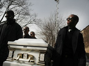 NEW YORK, NY - FEBRUARY 18:  The casket of Bronx teenager Ramarley Graham, who was shot to death by police officers earlier this month, is carried by family and friends following his funeral on February 18, 2012 in the Bronx borough of New York City. Family, friends, local politicians and community members paid their respects at Crawford Memorial United Methodist Church only blocks away from where the unarmed teen was shot and killed by police inside of his home on East 229th Street following a chase on February 2. (Photo by Spencer Platt/Getty Images)